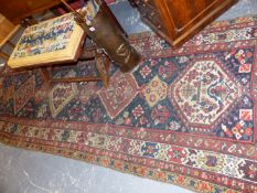 AN ANTIQUE PERSIAN TRIBAL RUNNER. 340x115cms.