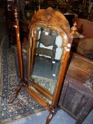 A QUEEN ANNE STYLE WALNUT CHEVAL MIRROR.