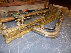 A 19TH.C.GILT BRASS EMPIRE STYLE FIRE FENDER WITH MATCHING FIRE DOGS AND IRONS TOGETHER WITH A