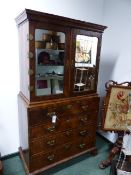 A GEORGIAN WALNUT SECRETAIRE BOOKCASE, WITH MIRRORED DOORS. MULTI DRAWER FITTED INTERIOR ABOVE THREE