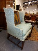 A GEORGIAN MAHOGANY FRAMED WING BACK ARMCHAIR.