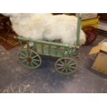 AN ANTIQUE GREEN PAINTED DOG CART