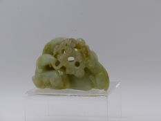 A CHINESE CARVED JADE GROUP OF RECUMBENT GOATS. LENGTH 10CMS.