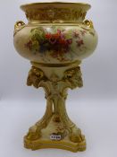 A ROYAL WORCESTER LARGE CENTREPIECE IN THE NEO CLASSICAL TASTE. TRIFORM BASE WITH RAM'S HEAD