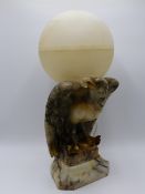 A CONTINENTAL ART DECO ALABASTER TABLE LAMP CARVED AS AN EAGLE WITH GLOBE FORM ALABASTER SHADE.