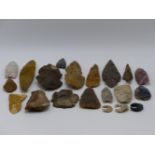 A GOOD COLLECTION OF VARIOUS KNAPPED FLINT SPEARS, AXE, ARROW HEADS AND TOOLS. (20)