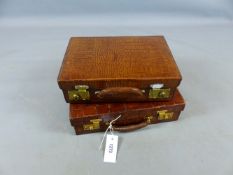 A SMALL CROCODILE SKIN ATTACHE CASE WITH GILT METAL LOCKS AND PIGSKIN LEATHER FITTED INTERIOR