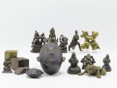 A GROUP OF MIDDLE AND FAR EASTERN BRONZE DEITIES AND ORNAMENTS, TWO BRASS SEAL BOXES, A BETEL LIME