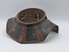 AN ANTIQUE BLACK AND WHITE ARMOUR ARTICULATED NECK GUARD.