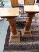 A PAIR OF CARVED HARDWOOD SPIRAL COLUMN PEDESTALS. 83CMS.HIGH