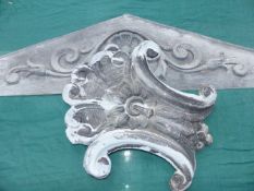 AN ANTIQUE ZINC EMBOSSED PEDIMENT AND APPLIQUE.