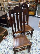 A PAIR OF CARVED OAK 18th.C.PANEL SEAT HIGH SLAT BACK CHAIRS.