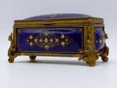 A ENAMELLED AND GILT METAL HINGED BOX, CUSHION LINED IN BEIGE SATEEN. (APPROX WIDTH 12.5 CMS).