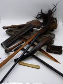 AN AFRICAN MANCALA FOLDING GAMES BOARD, A FLY WHISK WITH CARVED BIRD HEAD HANDLE, A CARVED TRIBAL