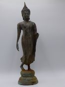 AN EASTERN BRONZE FIGURE OF A STANDING DEITY. HEIGHT 42CMS