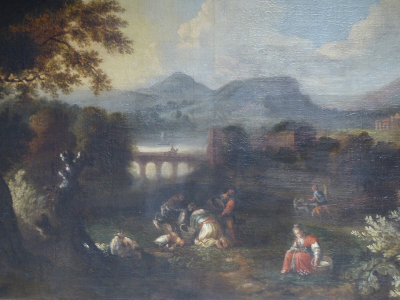 ITALIAN SCHOOL (18TH CENTURY), PEASANTS NEAR A TOWN IN A MOUNTAINOUS LANDSCAPE, OIL ON CANVAS, 89