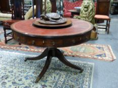 A REGENCY AND LATER INLAID MAHOGANY REVOLVING DRUM TABLE WITH GILT TOOLED RED LEATHER INSET TOP