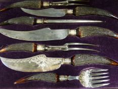 AN IMPRESSIVE LATE VICTORIAN CASED SILVER PLATE CARVING AND FISH SERVING SET WITH ANTLER HANDLES.