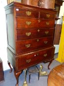 AN 18TH.C.AND LATER OAK CHEST ON STAND OF TWO SHORT AND FOUR LONG DRAWERS RAISED ON CABRIOLE LEGS.