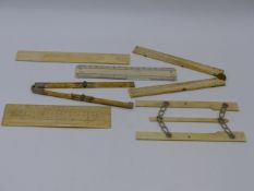 A GROUP OF 19TH.C.IVORY FOLDING RULERS AND SECTOR, ETC