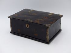 A HINGED TORTOISESHELL BOX WITH WHITE METAL ACCENTS, THE HANDLE IS PRESENT BUT ADRIFT FROM THE