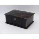 A HINGED TORTOISESHELL BOX WITH WHITE METAL ACCENTS, THE HANDLE IS PRESENT BUT ADRIFT FROM THE