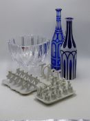 A CUT GLASS ORREFORS DEEP BOWL, THREE VINTAGE POTTERY TOAST RACKS AND TWO BOHEMIAN DECANTERS.