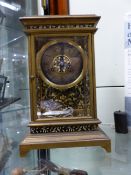 A GOOD VICTORIAN GILT BRASS AND ENAMEL THREE GLASS MANTLE OR DESK CLOCK WITH TWO TRAIN GONG STRIKE