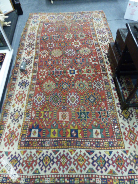 AN ANTIQUE CAUCASIAN KAZAK RUG. 250 X 132CMS