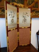 AN ANTIQUE CHINOISERIE TWO FOLD SCREEN WITH INSET EMBROIDERED PANELS.