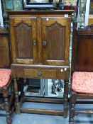 AN 18TH.C.OAK SMALL CABINET ON STAND. 64.5CMS WIDE.