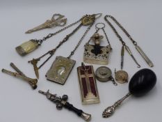 A WHITE METAL CHATELAINE, A PROPELLING INK PEN AND PENCIL BOTH WITH STONE SET TOPS, ONE SILVER AND