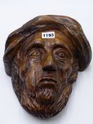 AN ANTIQUE CARVED WOOD PORTRAIT HEAD OF A BEARDED MAN. 26CMS HIGH.