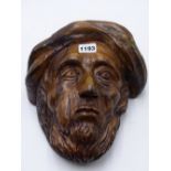 AN ANTIQUE CARVED WOOD PORTRAIT HEAD OF A BEARDED MAN. 26CMS HIGH.