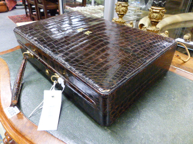 A SMALL CROCODILE SKIN DRESSING CASE WITH BRAMAH LOCK. (WIDTH 38 CMS.). - Image 2 of 4