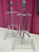 A PAIR OF LUCITE AND CHROME TABLE LAMPS.