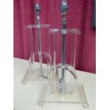 A PAIR OF LUCITE AND CHROME TABLE LAMPS.