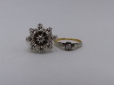 AN 18CT. WHITE GOLD DIAMOND CLUSTER RING, THE CLUSTER BEING MADE UP OF SEVENTEEN BRILLIANT CUT