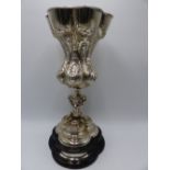 AN ORNATE SILVER HALLMARKED CHALICE ON PLINTH DECORTAED WITH A NEOCLASSICAL DESIGN. HALLMARKED