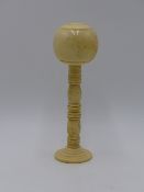 A 19TH. CENTURY TURNED BONE AND IVORY BILBOUQUET. 13 CMS. HIGH