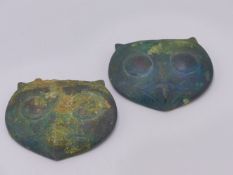 AN INTERESTING PAIR OF BRONZE MOUNTS FORMED AS OWL HEADS, POSSIBLY GRACO-ROMAN.