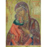 A RUSSIAN ICON PAINTED ON PANEL DEPICTING THE MADONNA AND CHILD, 35 X 31CM.