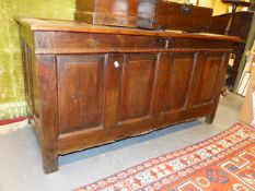 AN 18TH.C.OAK FOUR PANEL COFFER. 132CMS WIDE.