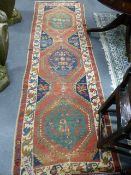 AN ANTIQUE PERSIAN KARADJA RUNNER. 282 X 90CMS