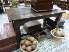 AN ANTIQUE AND LATER OAK CARVED SMALL REFECTORY TABLE WITH RECTANGULAR TOP AND SQUARE LEGS JOINED BY