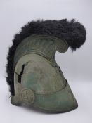 A 19TH.C.BRASS MILITARY HELMET WITH FUR PLUME.