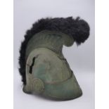 A 19TH.C.BRASS MILITARY HELMET WITH FUR PLUME.