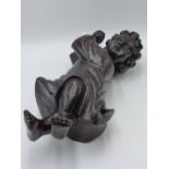 AN ANTIQUE CARVED WOOD FIGURE OF A CHILD WITH UP-STRETCHED ARMS. 42CMS HIGH