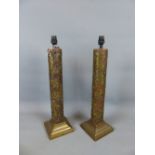 TWO VINTAGE BRASS MOUNTED PRINTING ROLLS ADAPTED AS TABLE LAMPS.