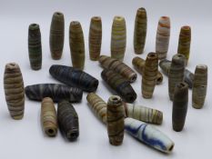 A GROUP OF TWENTY FIVE VARIOUS LARGE GLASS TRADE BEADS ( 19TH CENTURY)